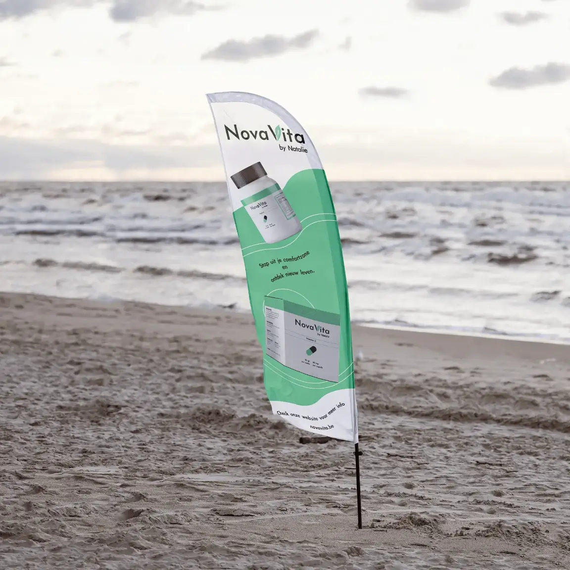 This is a mockup of a beach flag with an add for NovaVita